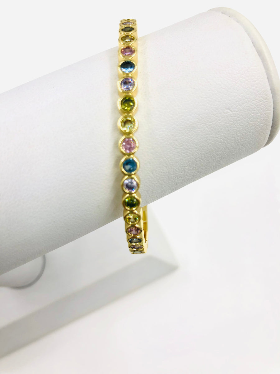 BANGLE WITH SOFT COLORED, BEZLED STONES IN GOLD